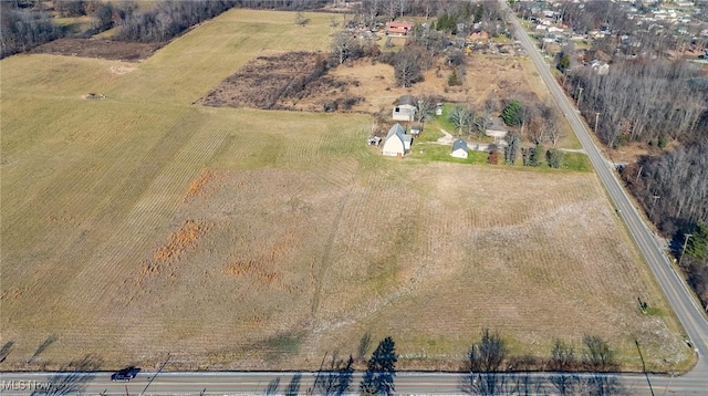 birds eye view of property with a rural view