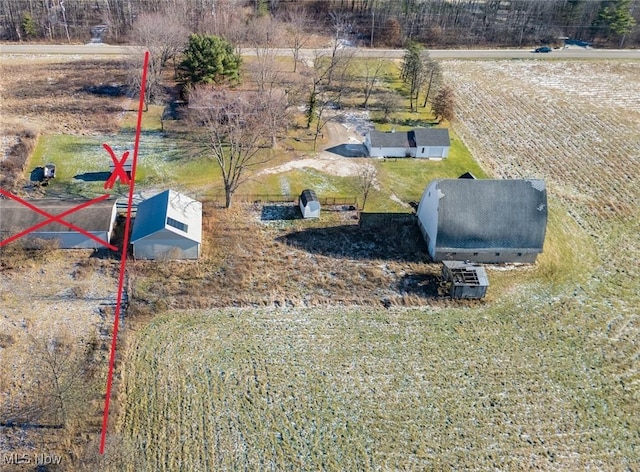 birds eye view of property with a rural view