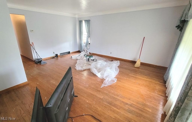 empty room with hardwood / wood-style floors