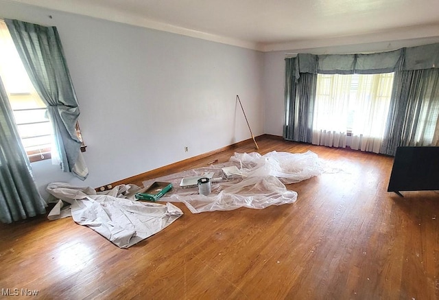 unfurnished room featuring hardwood / wood-style floors