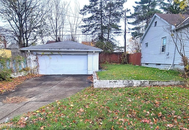 garage featuring a lawn