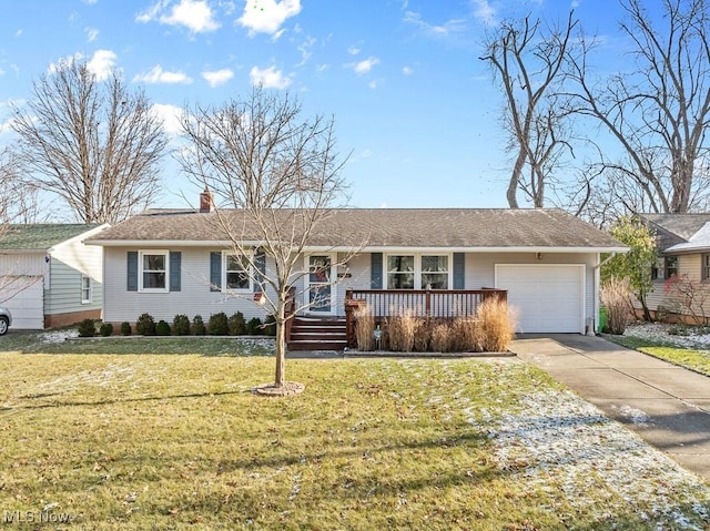 ranch-style home featuring a front lawn, covered porch, and a garage