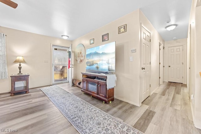 corridor with light hardwood / wood-style flooring