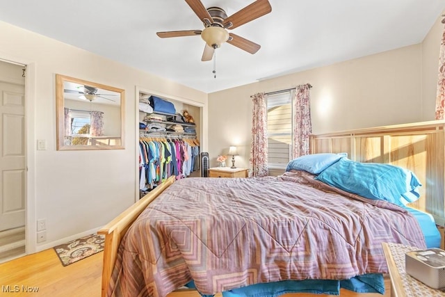 bedroom with ceiling fan, a closet, and wood-type flooring