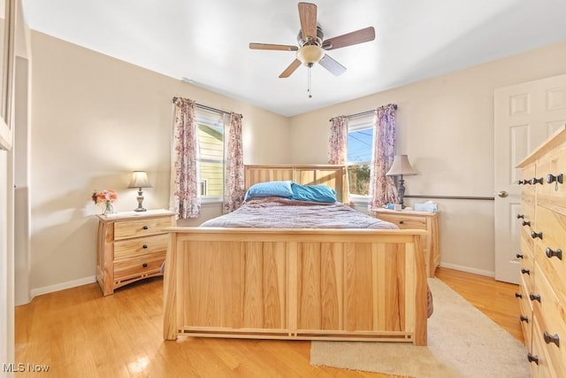 bedroom featuring light hardwood / wood-style flooring and ceiling fan