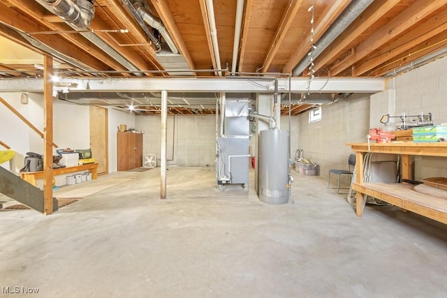 basement featuring heating unit and gas water heater