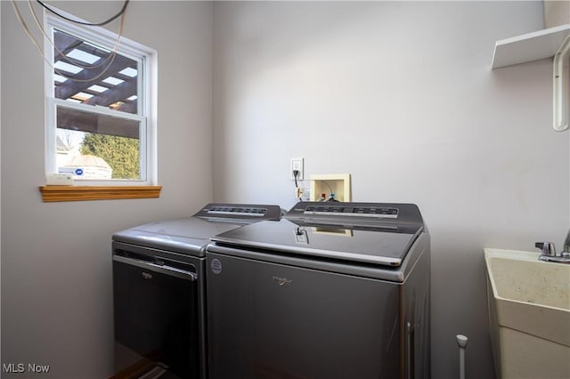 laundry area featuring washer and dryer and sink