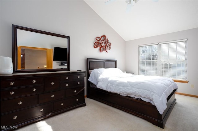 bedroom featuring ceiling fan, light carpet, and high vaulted ceiling