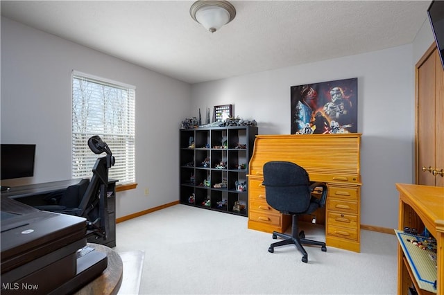 office area with light colored carpet and a textured ceiling