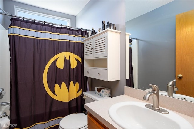 bathroom with a shower with curtain, vanity, toilet, and vaulted ceiling