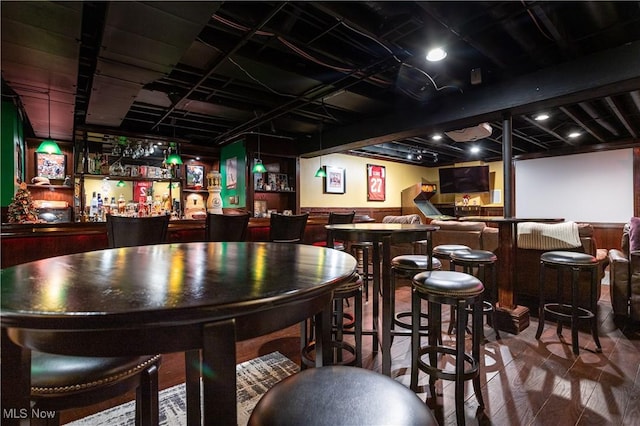 bar with wood-type flooring