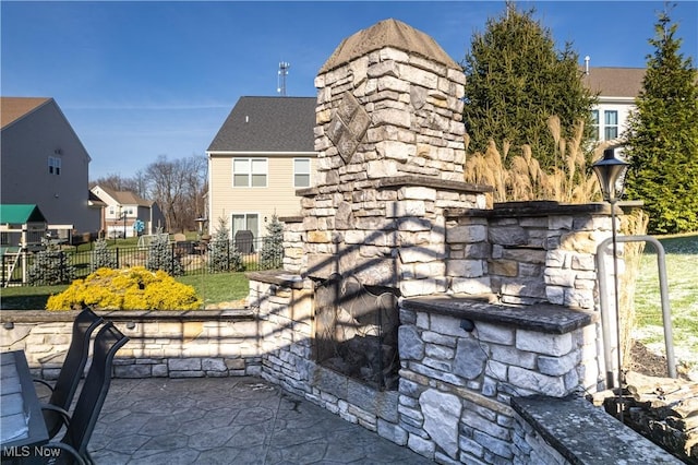 exterior space featuring an outdoor stone fireplace