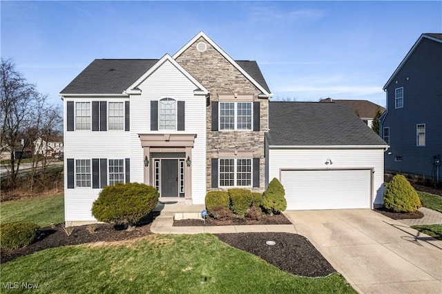 view of front of property with a garage and a front yard