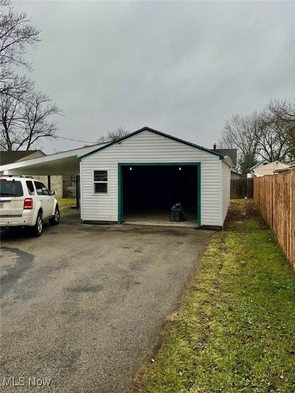 garage featuring a carport