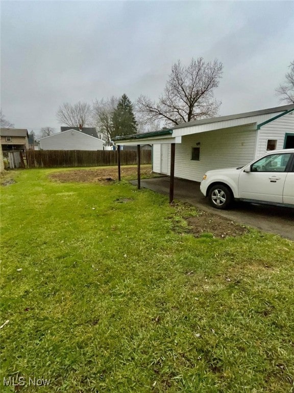 view of yard featuring a carport