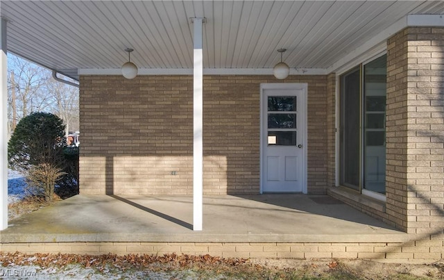 entrance to property with a patio area