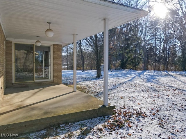 view of snow covered patio