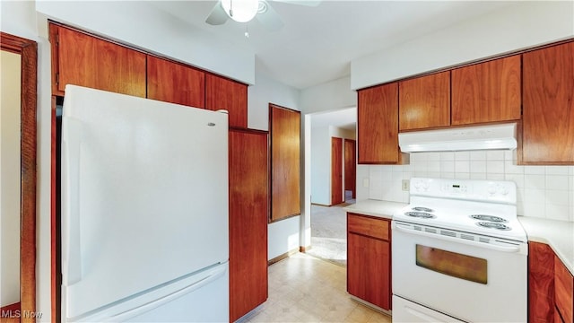 kitchen featuring ceiling fan, white appliances, and tasteful backsplash