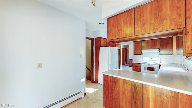 kitchen featuring white appliances, tasteful backsplash, a baseboard heating unit, and sink