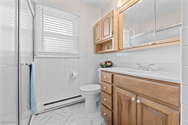 bathroom featuring vanity, a baseboard radiator, tile walls, and toilet