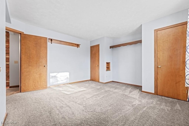 unfurnished bedroom with carpet flooring