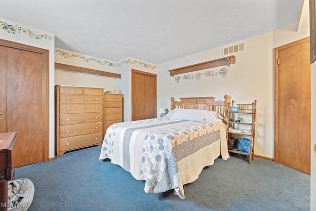 bedroom with dark colored carpet