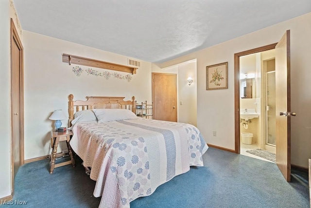 bedroom featuring dark colored carpet and connected bathroom