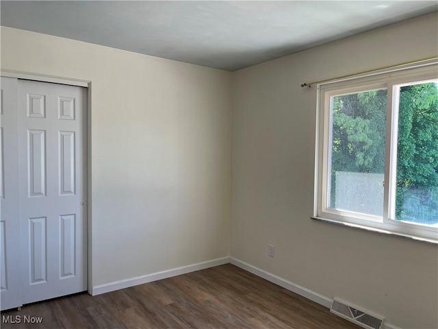 empty room featuring dark hardwood / wood-style floors