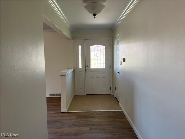 doorway with dark hardwood / wood-style floors and crown molding