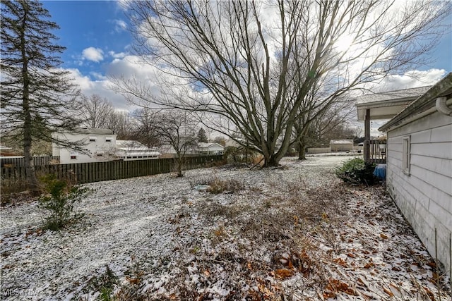 view of yard covered in snow