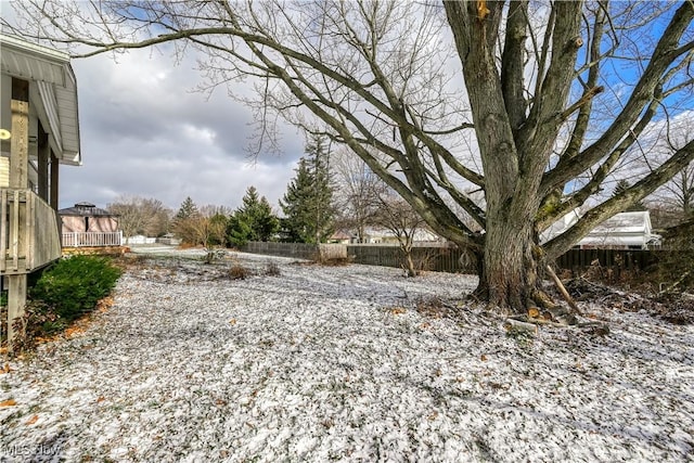 view of yard layered in snow