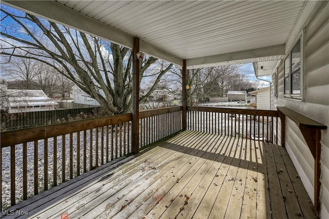 view of snow covered deck