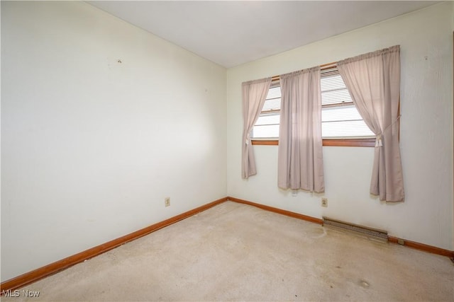 empty room with light colored carpet