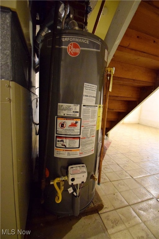 utility room with gas water heater