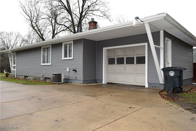 view of property exterior with a garage, concrete driveway, a chimney, and cooling unit