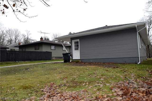 view of home's exterior with a lawn