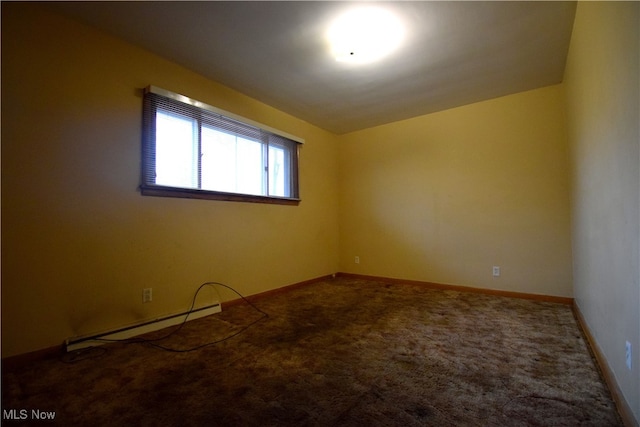 carpeted spare room with baseboard heating and lofted ceiling