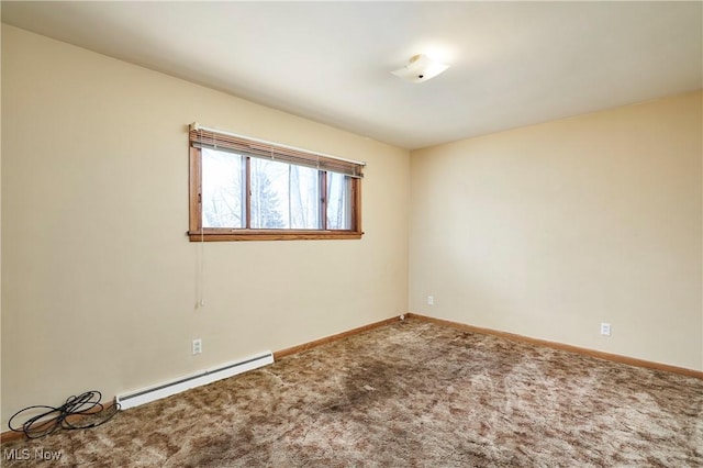 unfurnished room featuring a baseboard heating unit, carpet floors, and baseboards