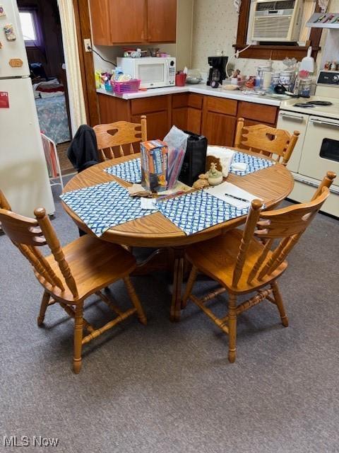 dining room with carpet floors