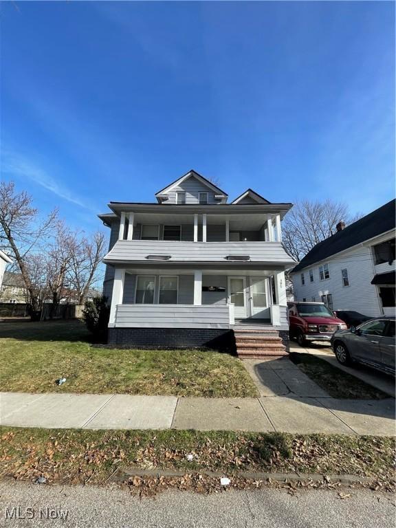 view of front facade with a porch and a front yard