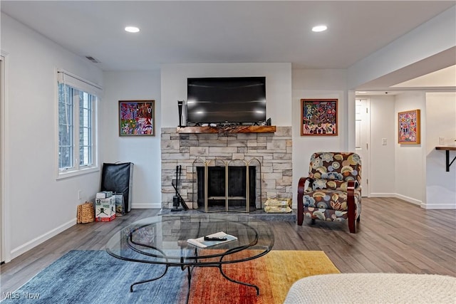 living room with a fireplace and hardwood / wood-style floors