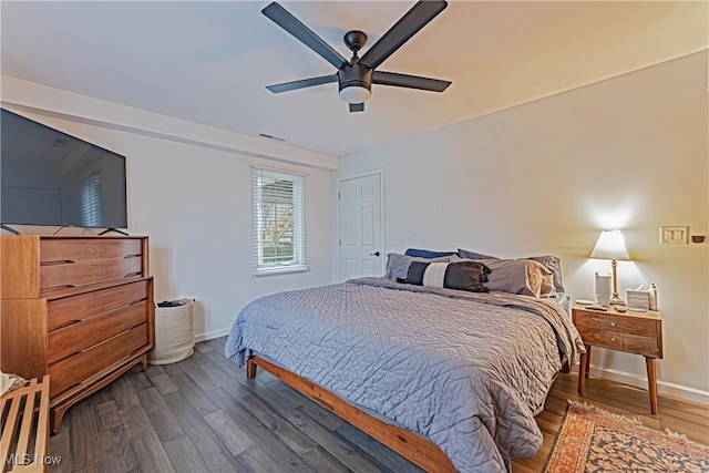 bedroom featuring ceiling fan and dark hardwood / wood-style flooring