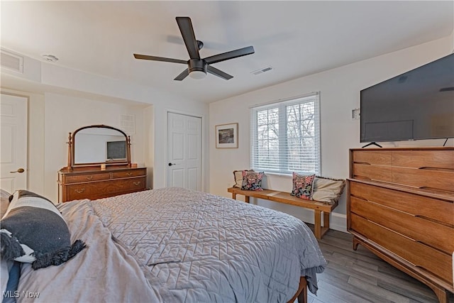 bedroom with wood-type flooring and ceiling fan