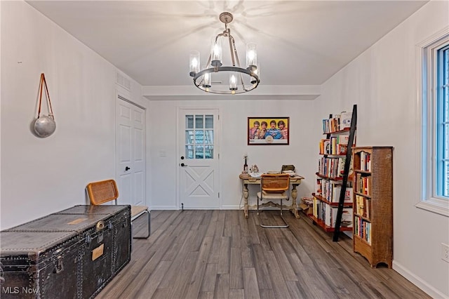 interior space featuring a chandelier and hardwood / wood-style flooring