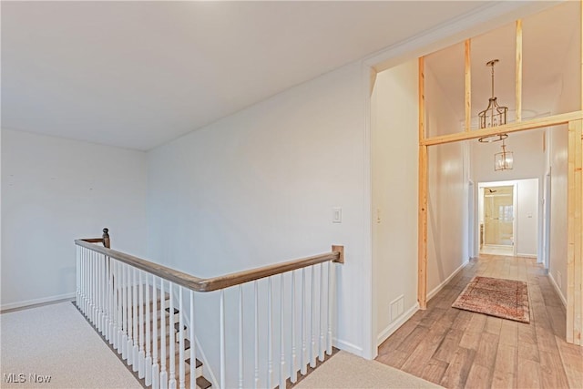 hallway with hardwood / wood-style floors