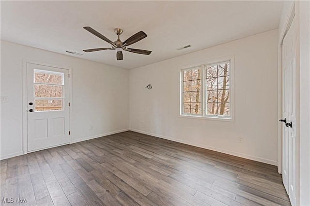 unfurnished room featuring ceiling fan and wood-type flooring