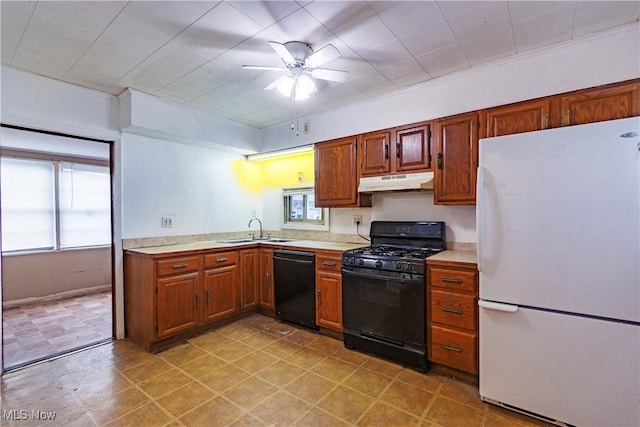 kitchen featuring ceiling fan, sink, a wealth of natural light, and black appliances