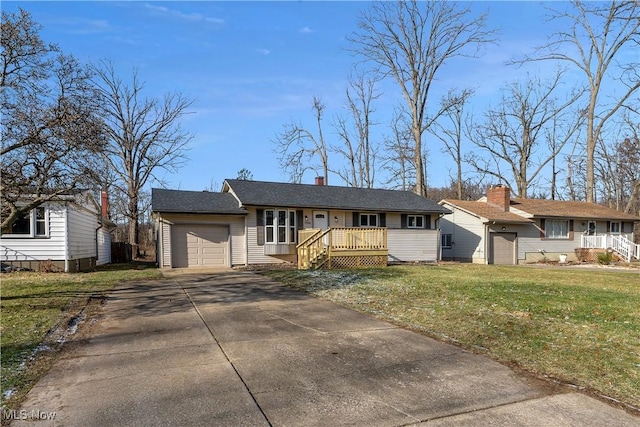 ranch-style house with a deck, a front yard, and a garage