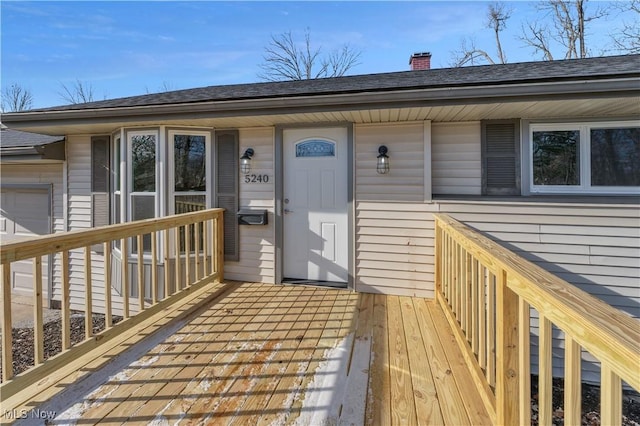 property entrance with a deck