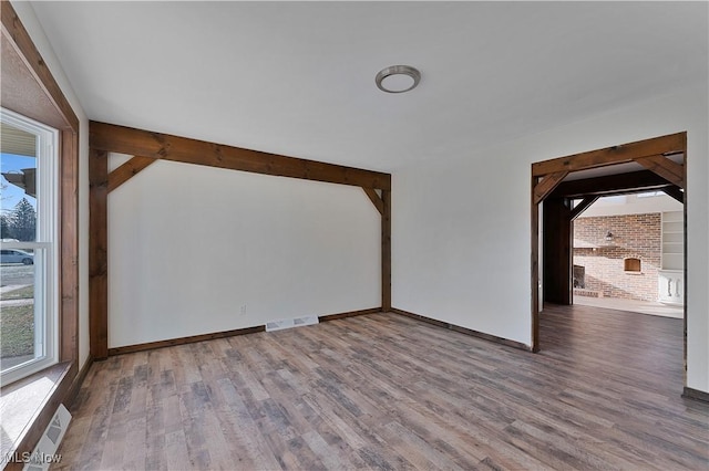 unfurnished room featuring wood-type flooring